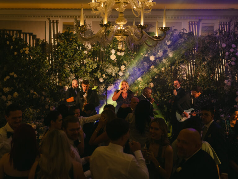 Live band performing with dynamic party lighting