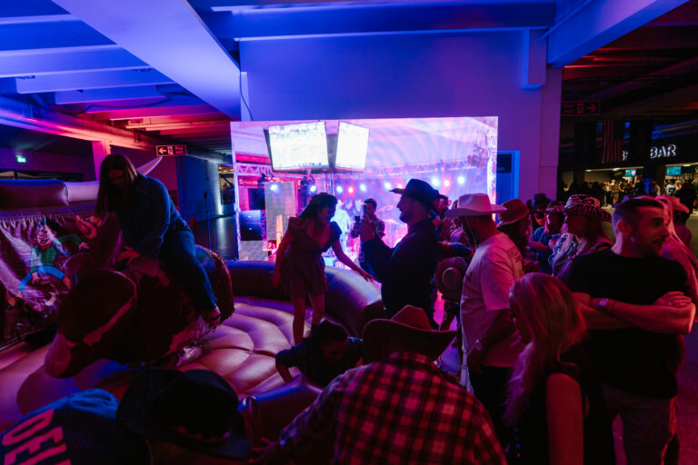 Rodeo bull ride with LED videowall in the background