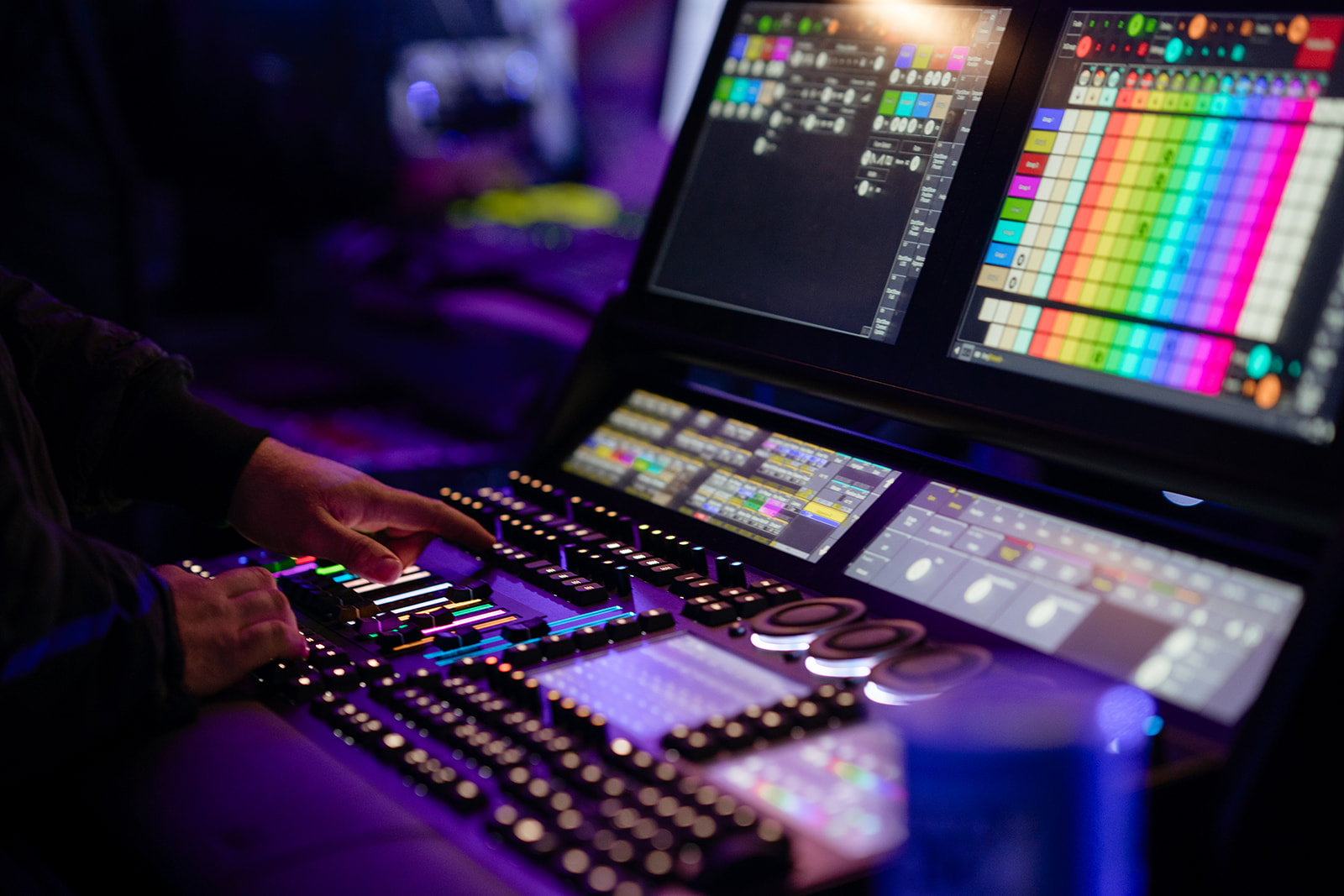 Engineer operating a lighting desk