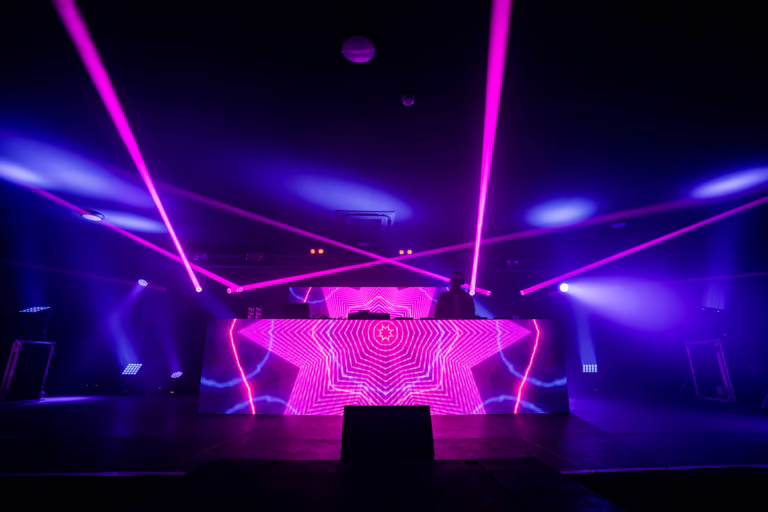 Clean Bandit performing on stage with videowall DJ booth