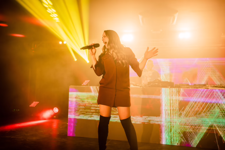 Clean Bandit performing on stage with videowall DJ booth