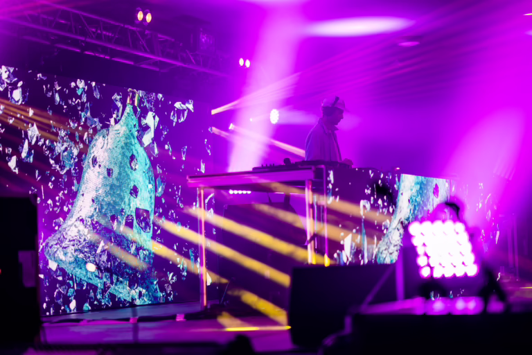 Clean Bandit performing on stage with videowall DJ booth