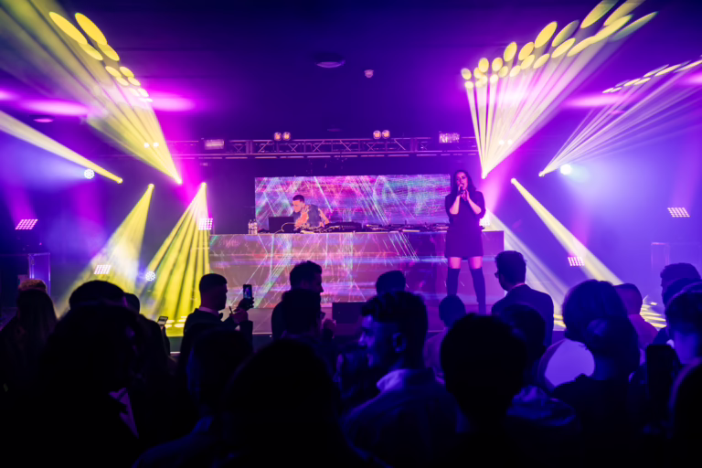 Clean Bandit performing on stage with videowall DJ booth