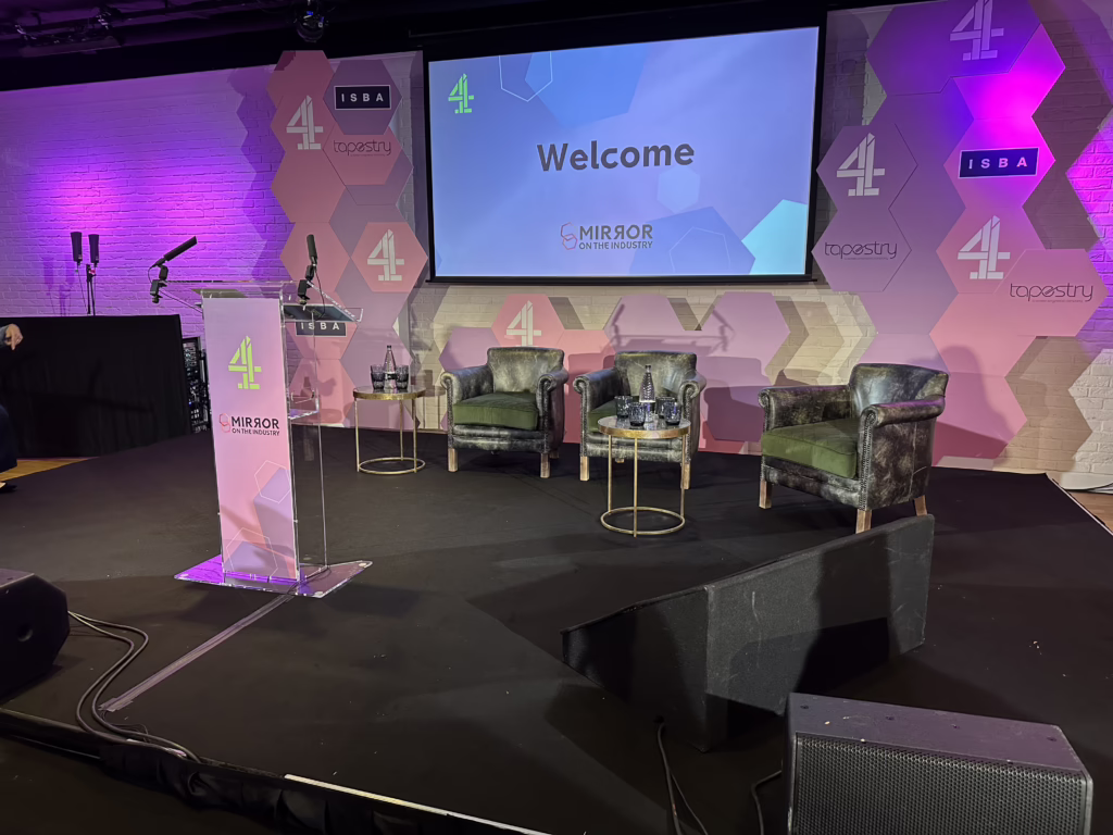 Conference + panel discussion stage with projection, seating and lectern