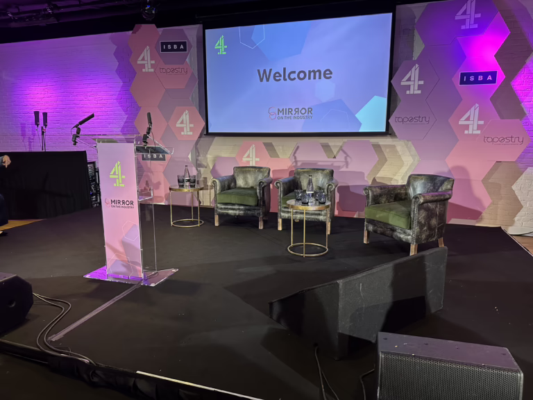 Conference + panel discussion stage with projection, seating and lectern